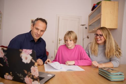 Family looking at computer